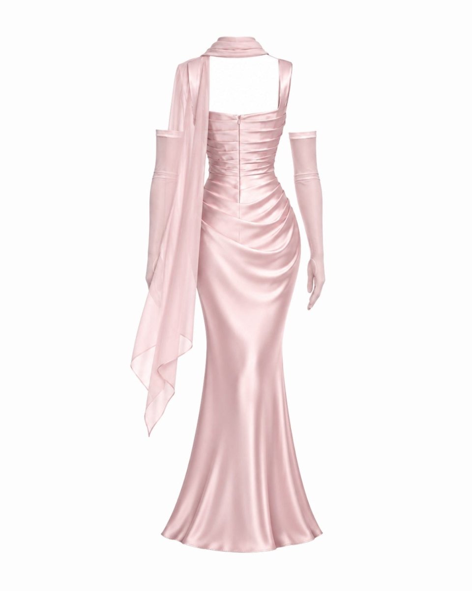 A light pink satin evening gown with a halter-style neckline, long draped sleeves, and a fitted mermaid silhouette, shown on a plain white background.