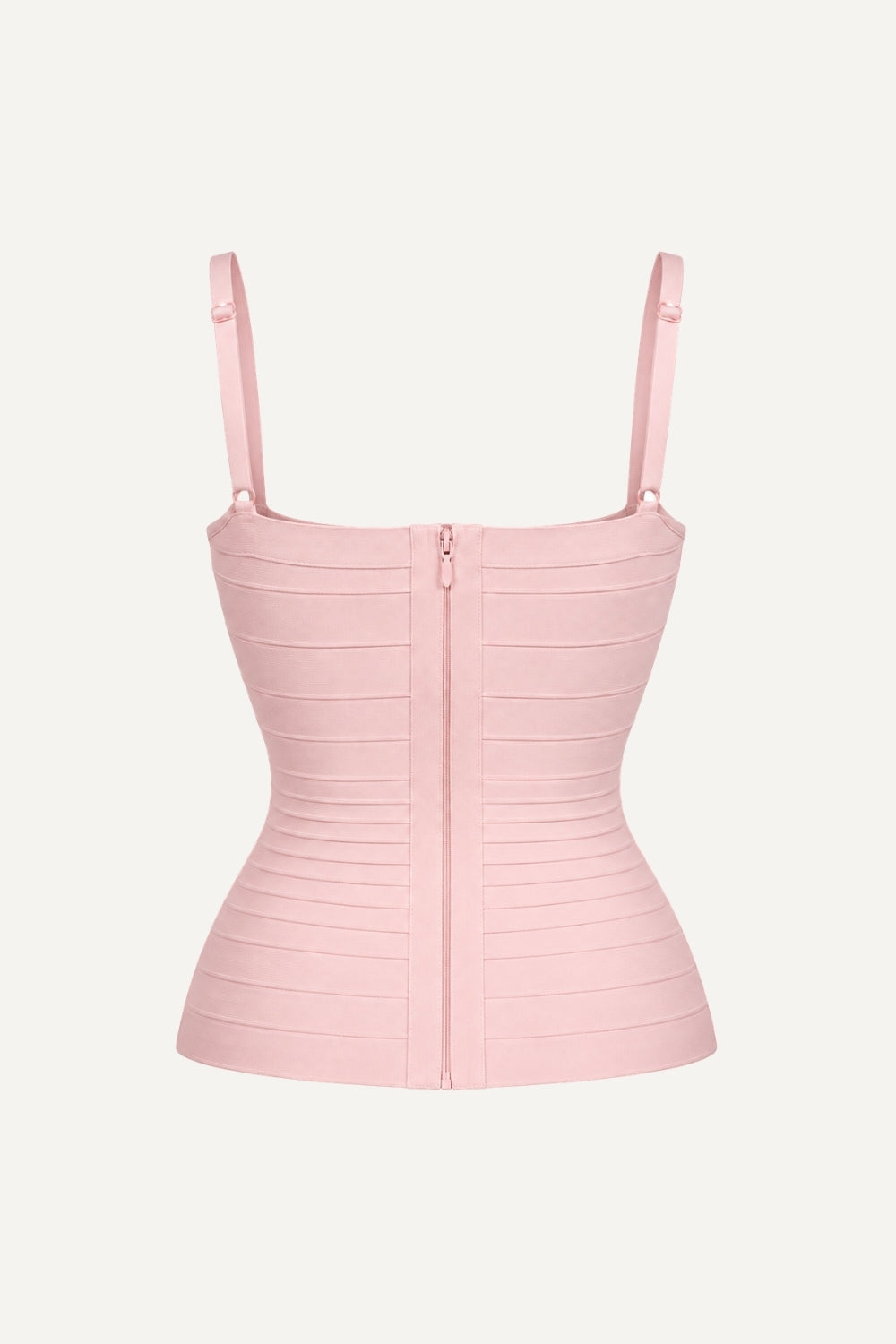 A light pink ribbed knit camisole top with thin shoulder straps, a square neckline, and a central front zipper, shown against a plain off-white background.