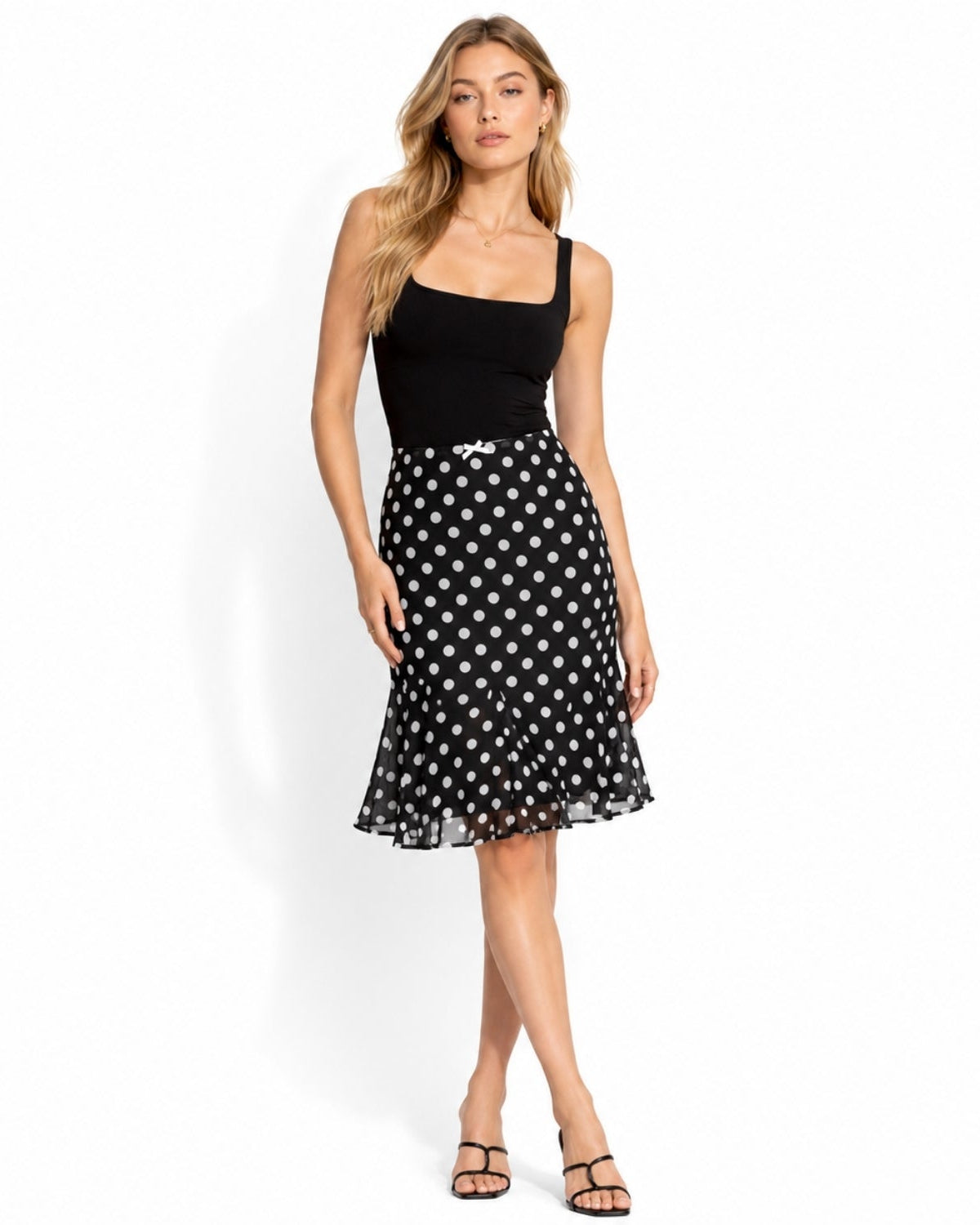 profile of black and white polka dot trumpet midi skirt with sheer chiffon overlay