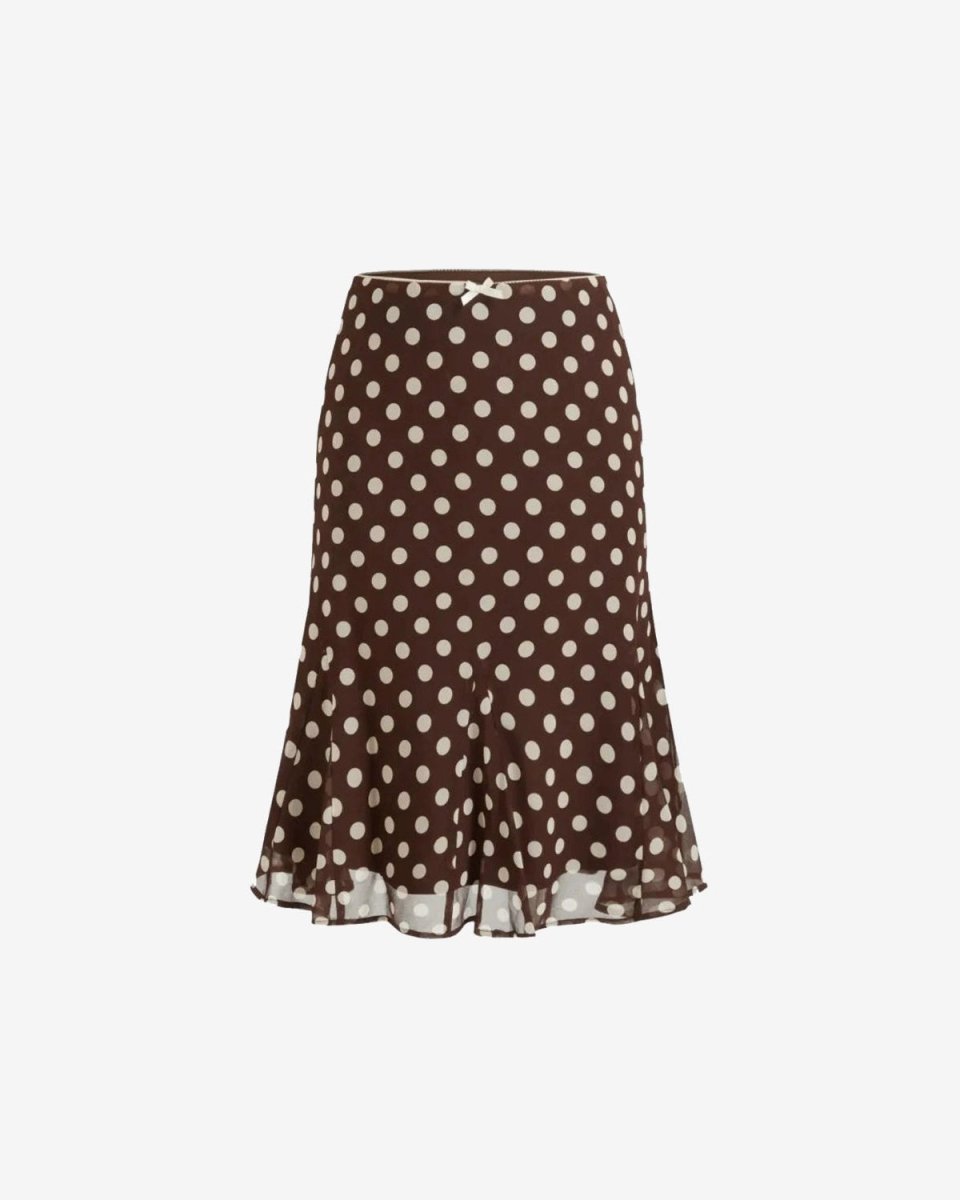 A brown midi skirt with a white polka dot pattern and a ruffled hem, shown against a plain light gray background.