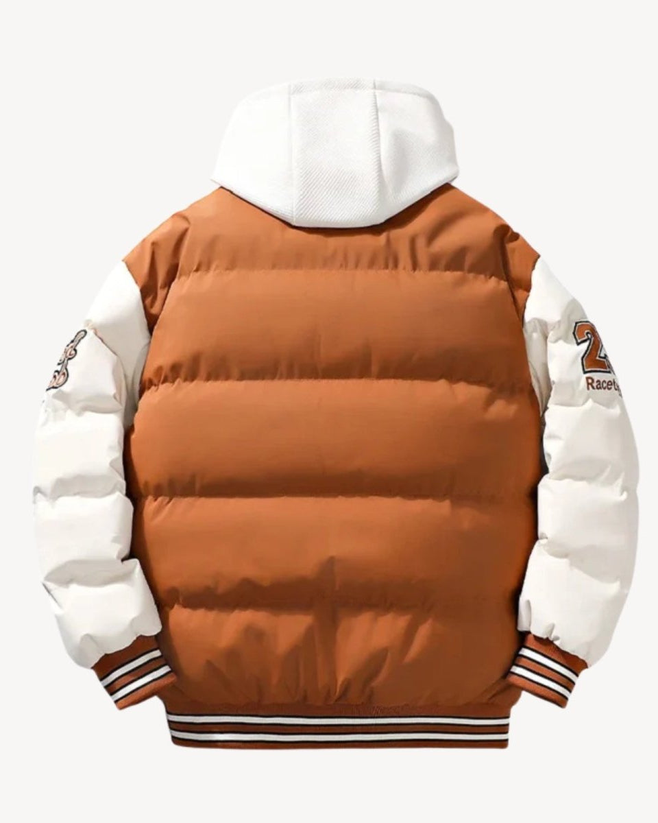 Rear product view of the cognac camel puffer jacket, detailing the embroidered patches on the back of the sleeves.
