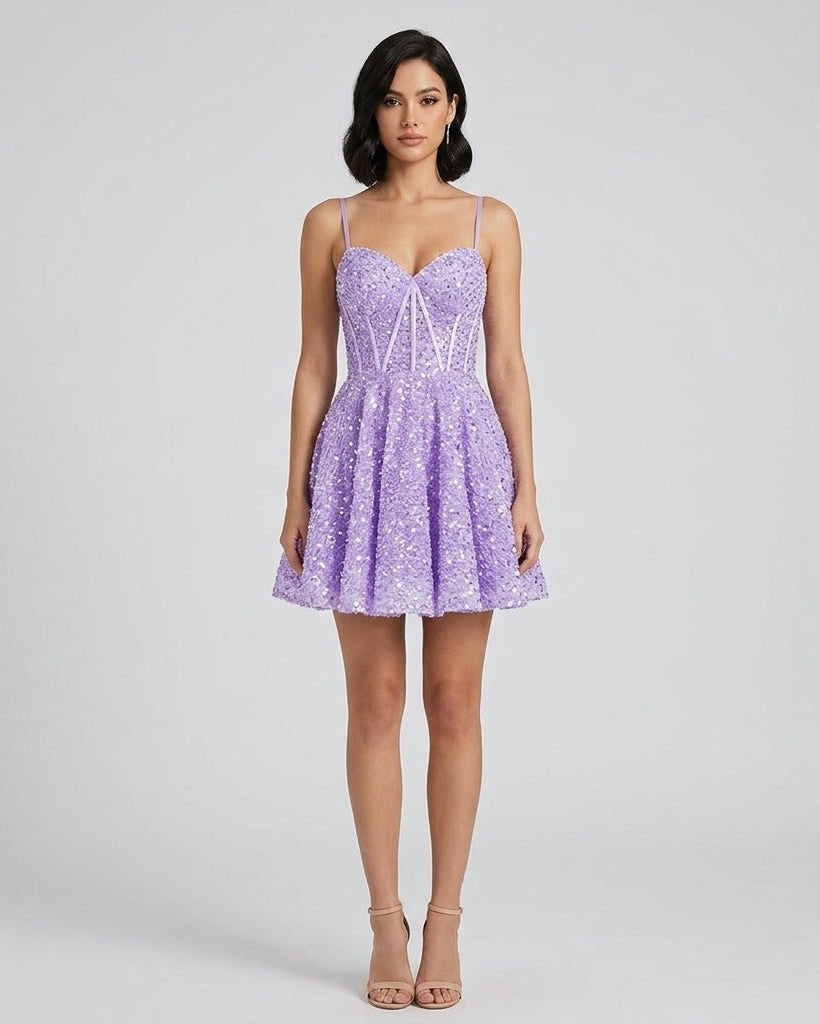 Front view of the purple sequin corset mini dress featuring a sweetheart neckline and flared skirt worn by a brunette model.