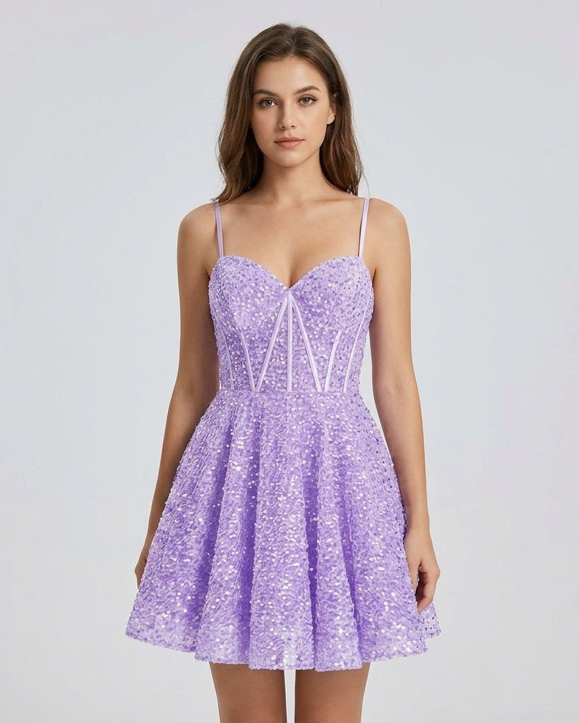 Female model wearing the short purple sequin homecoming dress featuring a structured boned bodice and shimmering finish.