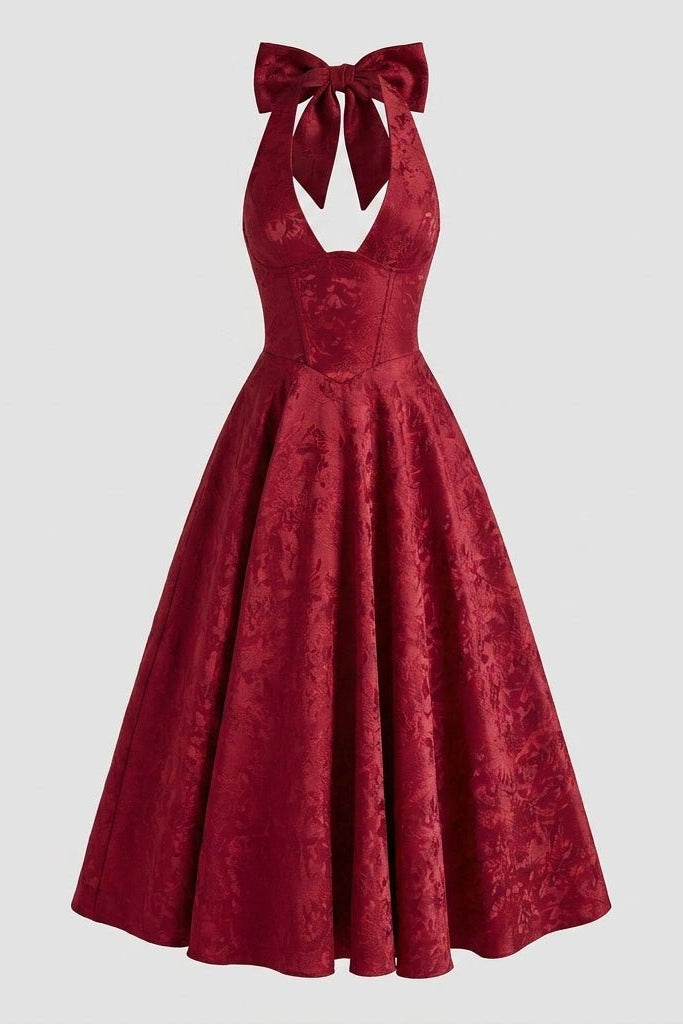 Flat lay front view of the Kouvr deep red floral jacquard halter midi dress showing detailed corset seaming and v-neckline structure.
