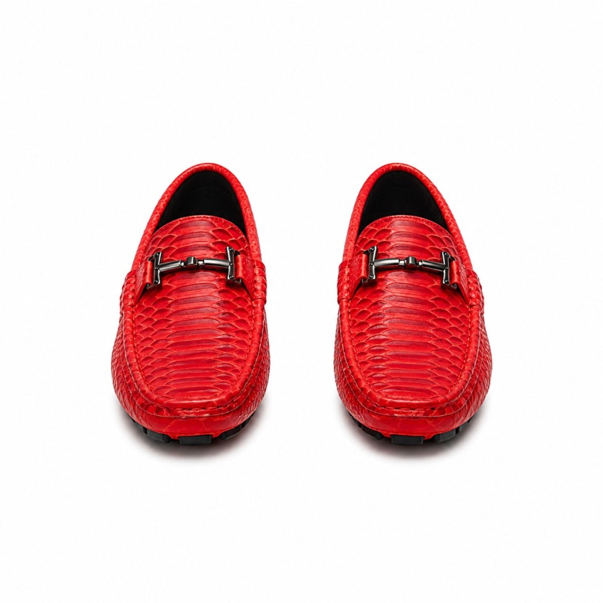 A pair of bright red textured leather loafers with a black metal horsebit detail on the vamp, shown from a top-down view on a white background.