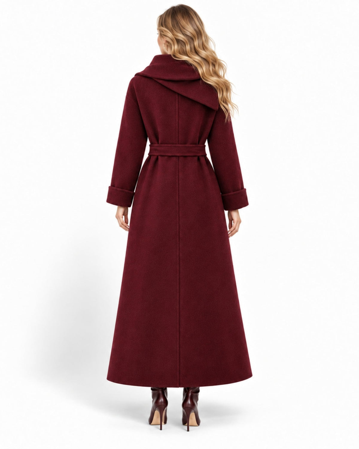 A woman viewed from the back wearing a long burgundy wrap coat with a matching waist belt, paired with dark brown high-heeled shoes, against a plain white background.