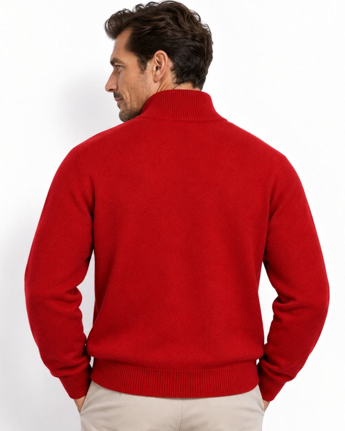 A man wearing a bright red knit sweater with a mock neck, shown from the back against a plain white background.