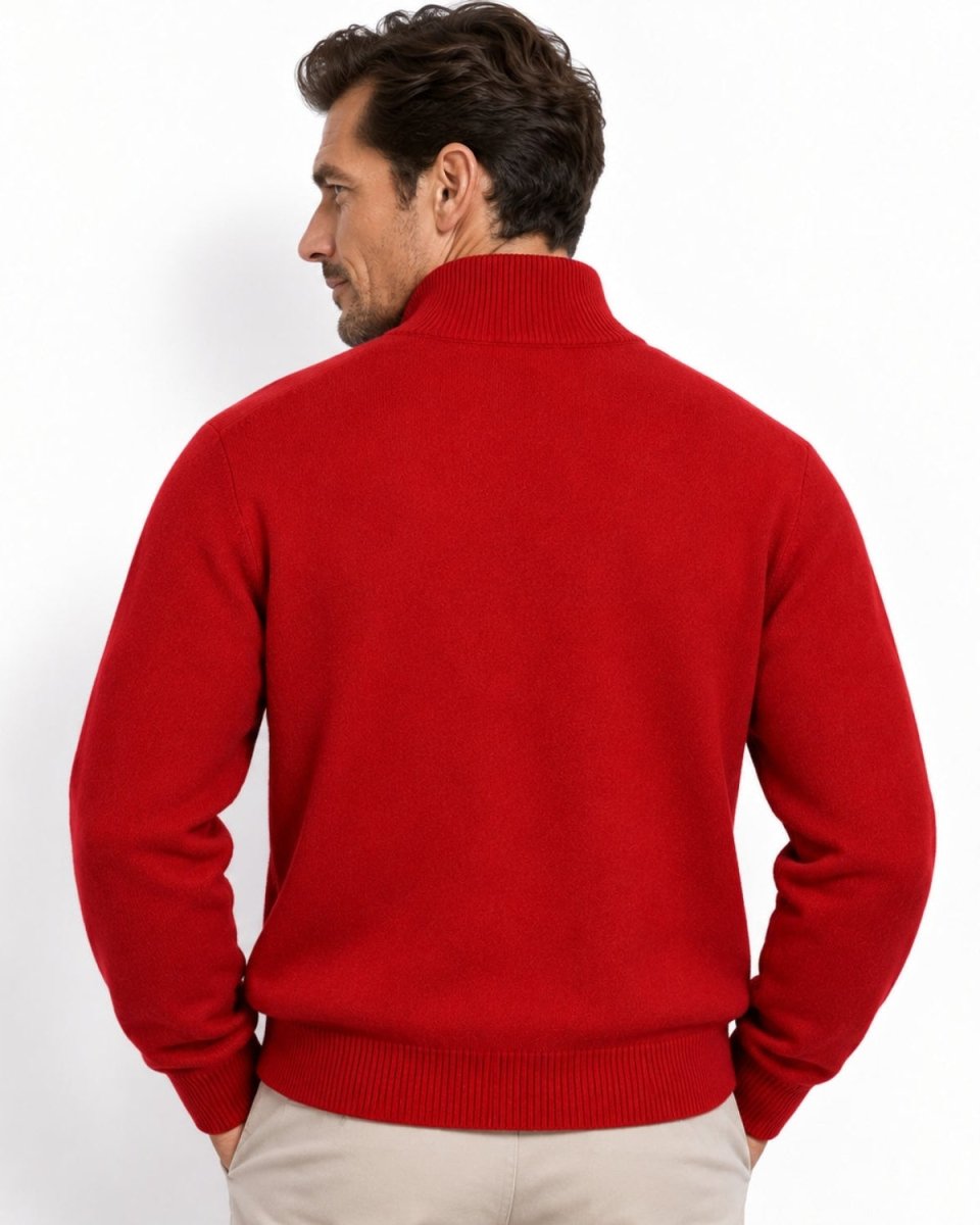 A man wearing a bright red knit sweater with a mock neck, shown from the back against a plain white background.