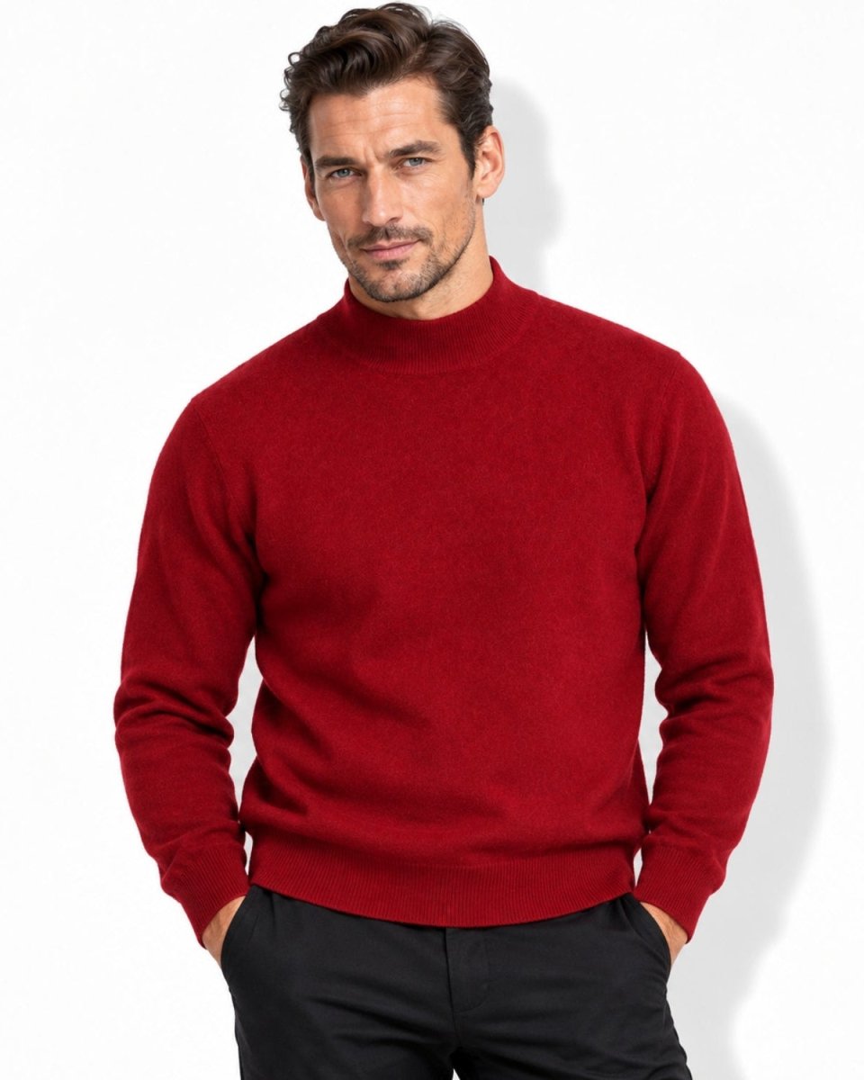 Handsome man wearing a red cashmere mock neck sweater with hands in pockets, looking directly at the camera, showcasing smart casual winter fashion.