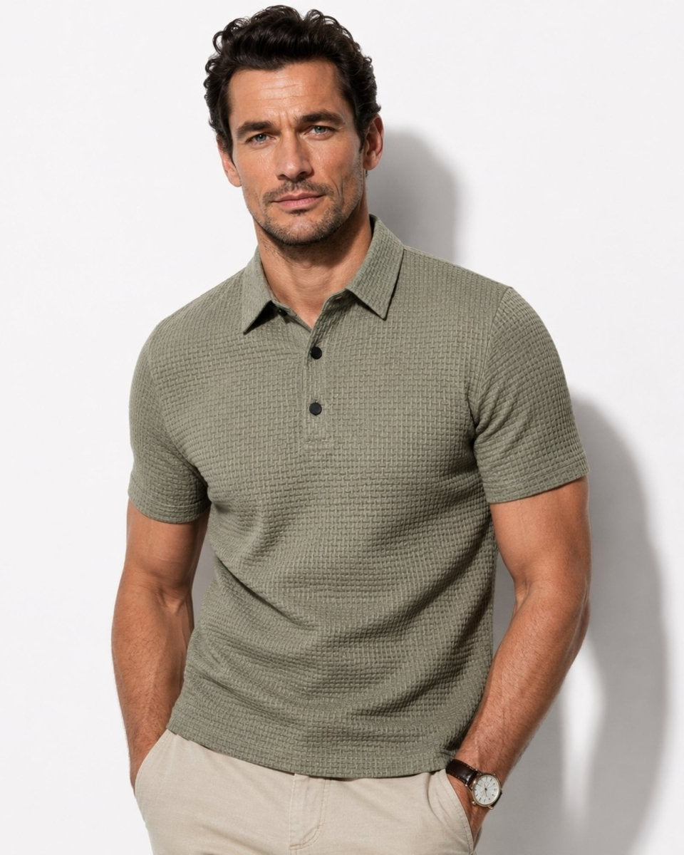 Man wearing a green checkered polo shirt against a white background