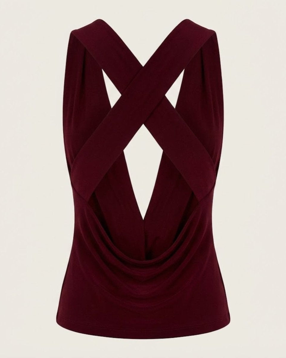 Flat lay product shot of the back of the Rhea top in burgundy, emphasizing the criss-cross straps and backless design.