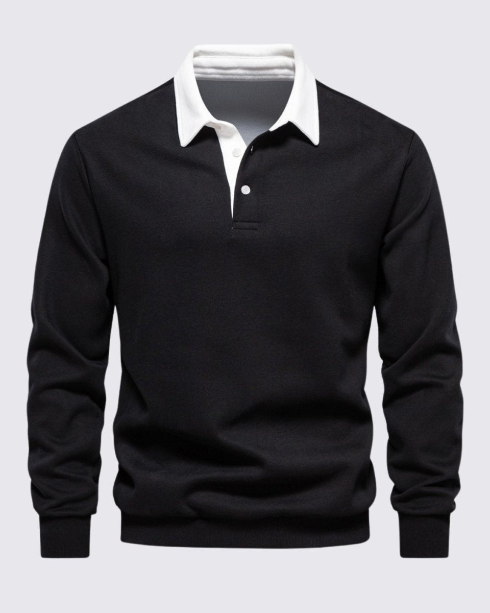 Flat product shot of the Rhodes black long sleeve knit polo with a white collar, showing the texture of the fabric and button placket.