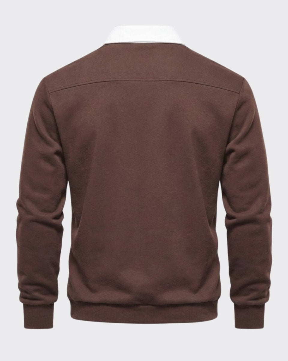 Product-only shot of the back of the dark brown polo sweater, highlighting the clean construction and shoulder yoke detail.