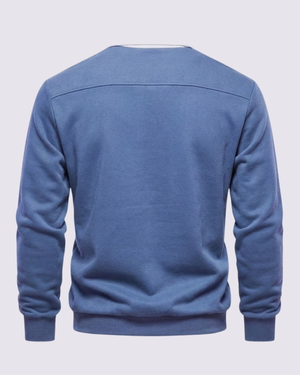 Flat lay back view of the steel blue Rhodes polo sweater, detailing the horizontal back yoke and premium knit texture.