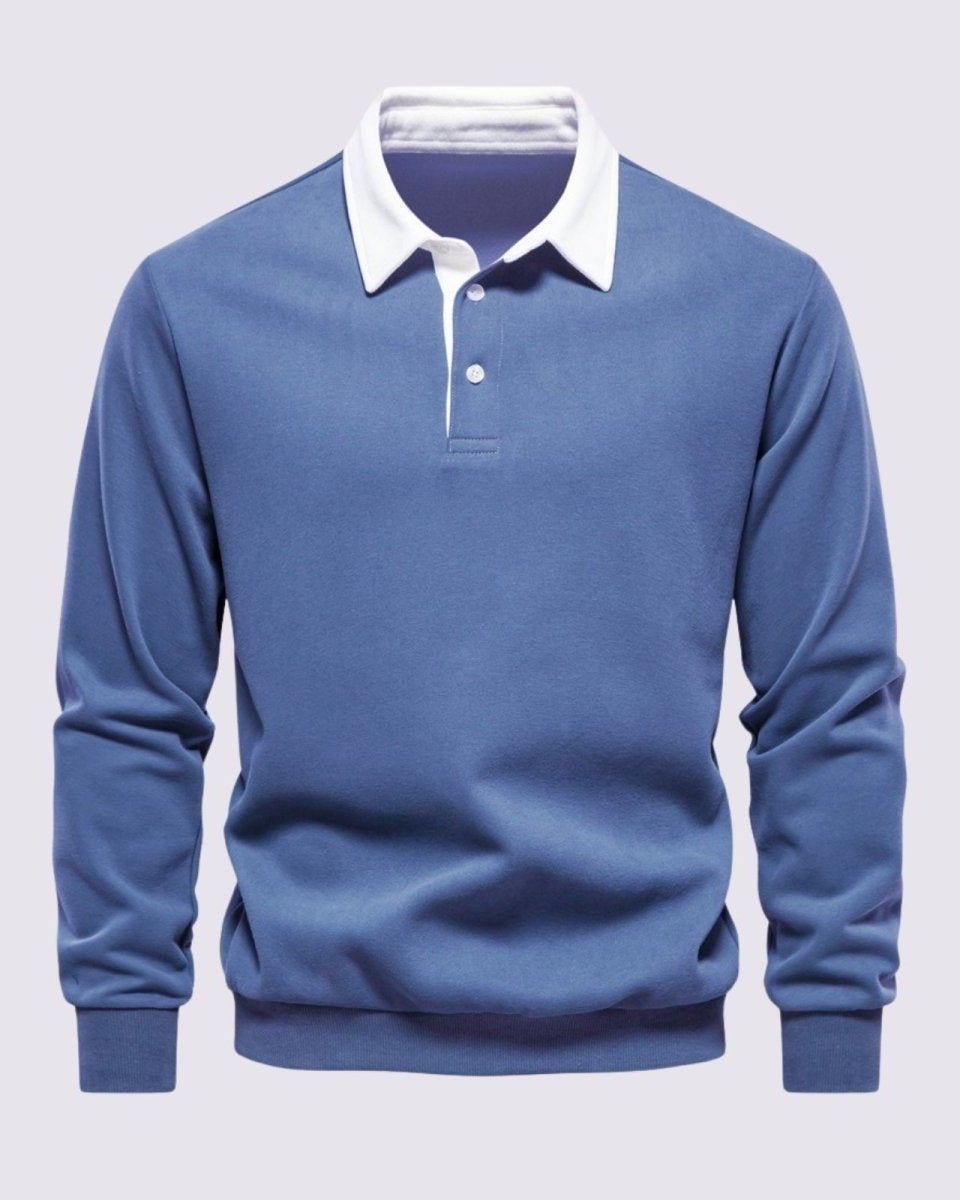 Flat lay front view of the Rhodes  long sleeve polo sweater in steel blue, highlighting the white contrast collar and two-button placket.
