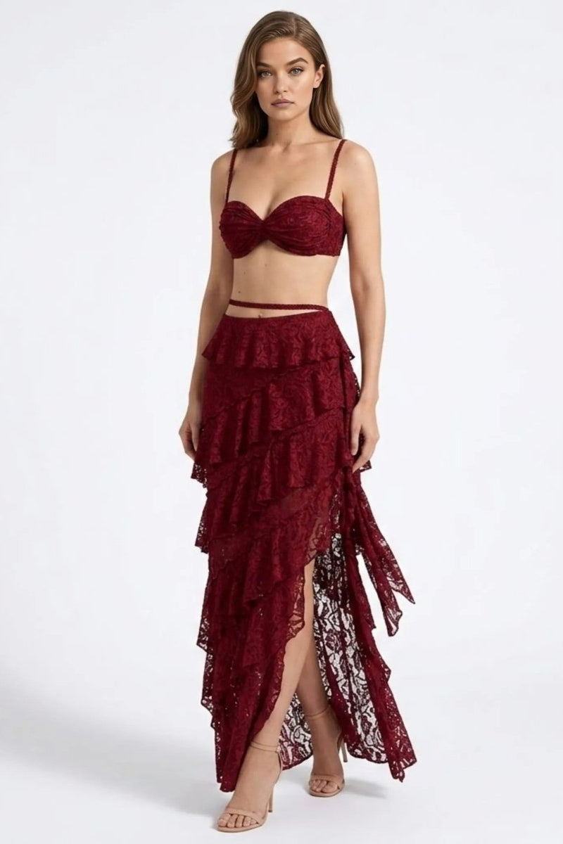 Front view of an affordable luxury wine red lace matching co-ord set with ruched top and high-waisted high-low skirt.