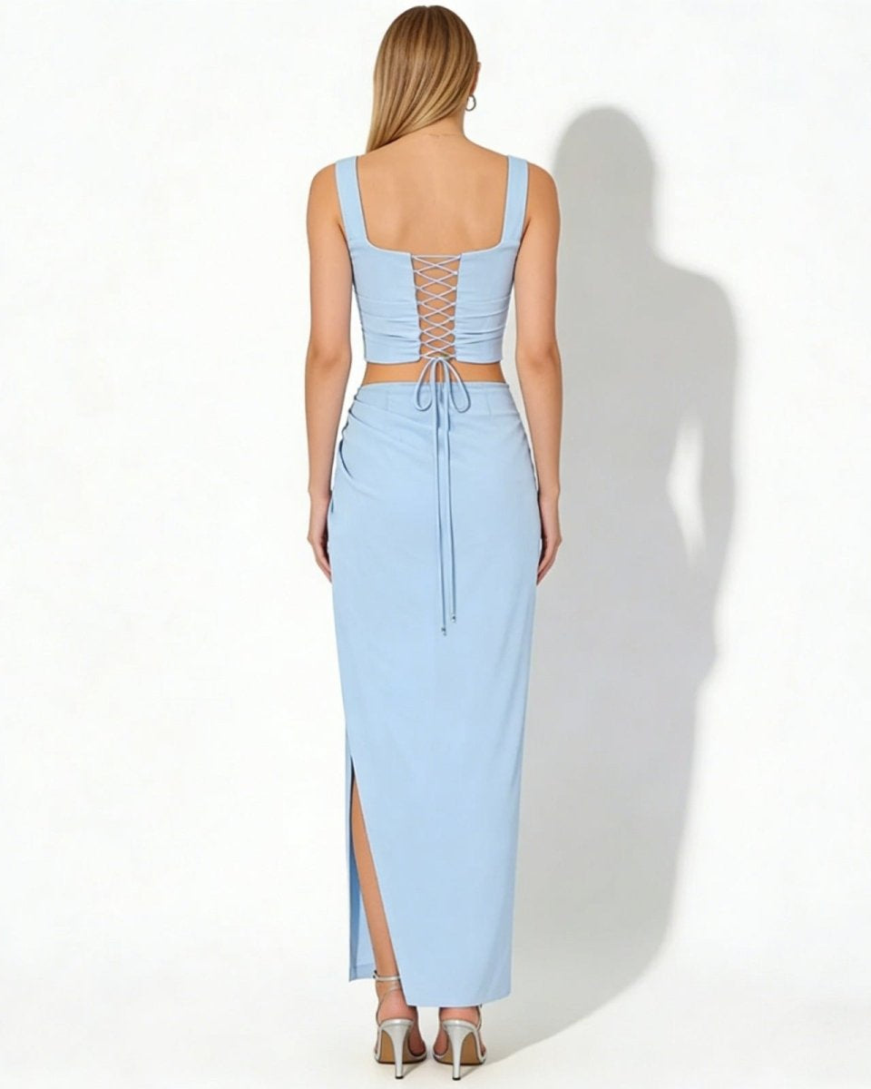 Back view of the Rona set in light blue, highlighting the adjustable lace-up detail on the corset crop top.