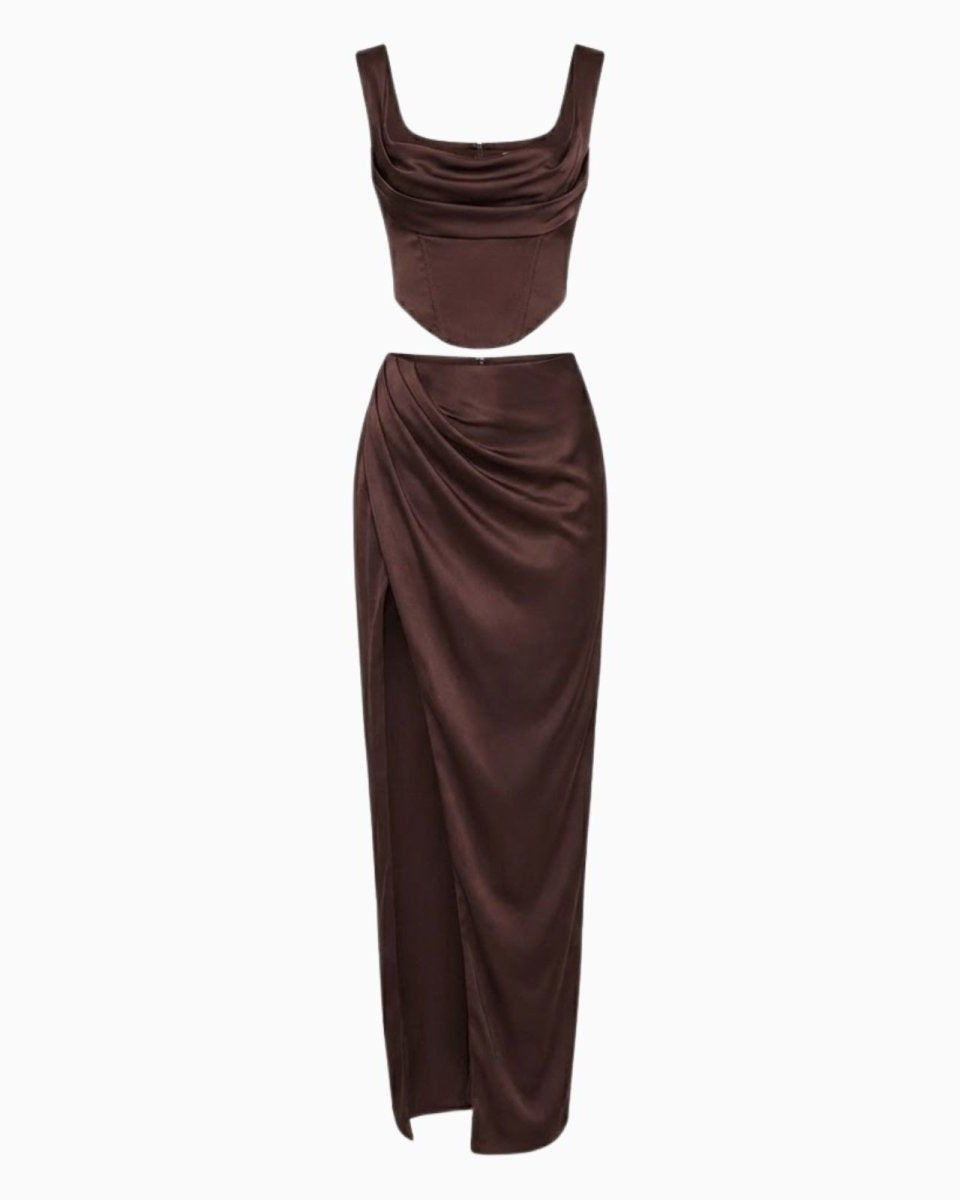 Flat lay of the Rona satin set in dark brown, displaying the front of the cowl neck corset top and draped high-slit maxi skirt.