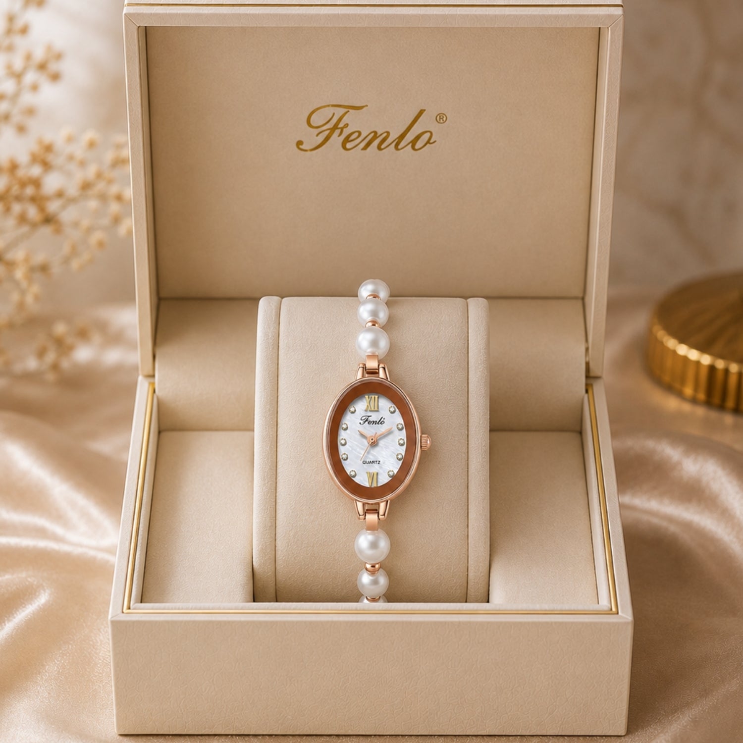 Luxury rose gold oval women's watch with pearl bracelet and mother of pearl dial displayed in a premium beige Kouvr presentation gift box.