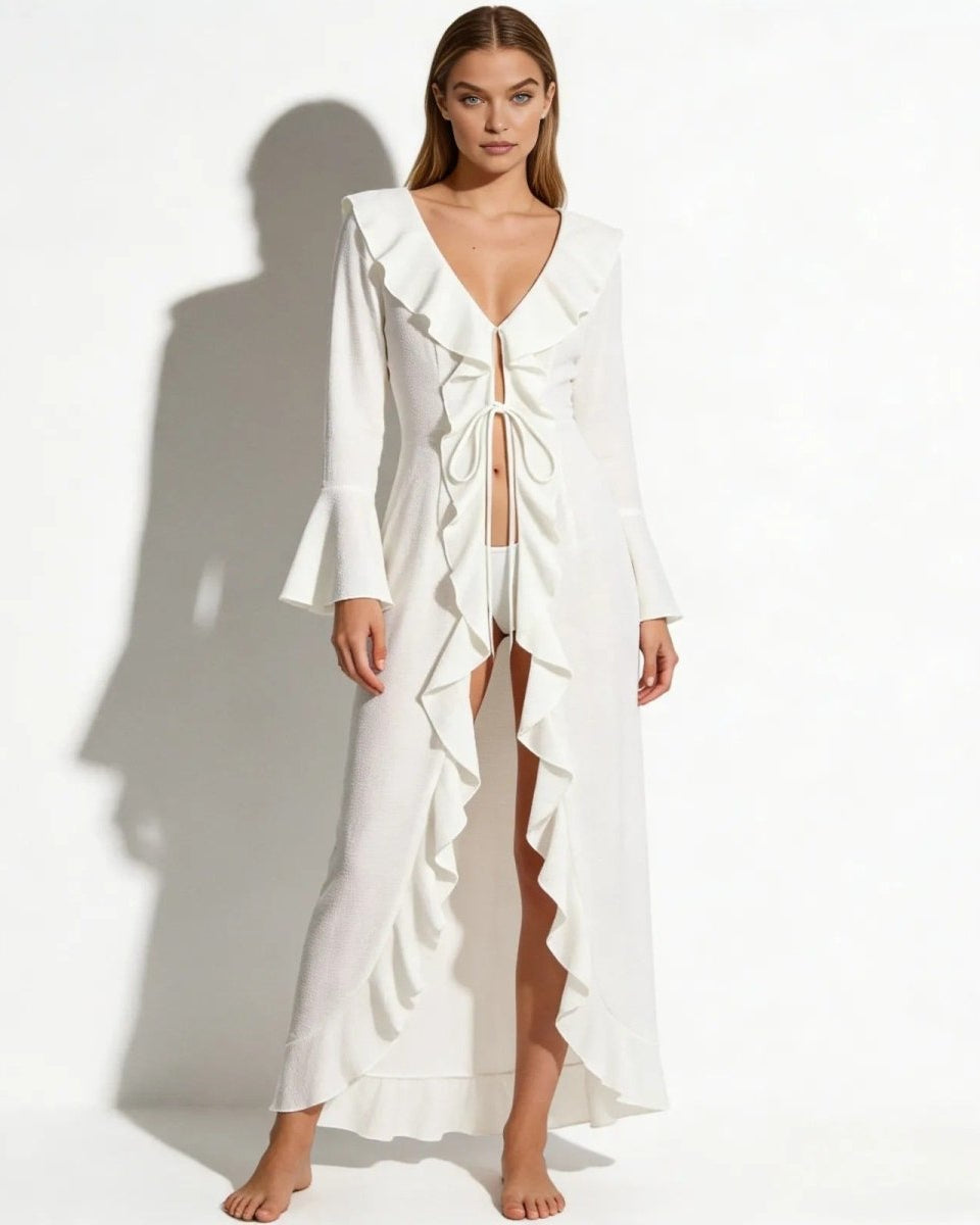 Model wearing the Roseta white ruffle maxi cover up, shown from the front with tie-front detail.