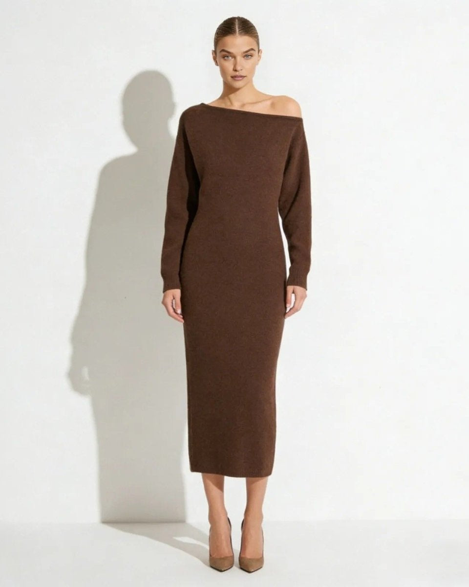 Model wearing the Selena off-the-shoulder long sleeve sweater dress in dark brown, showing the elegant asymmetrical neckline from the front.