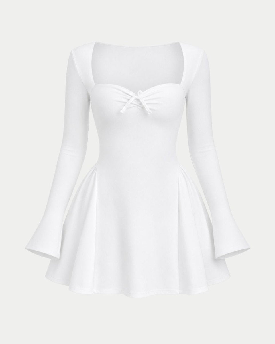 A white long-sleeve skater dress with a sweetheart neckline, a small bow detail at the center bust, and a flared skirt, shown against a light gray background.
