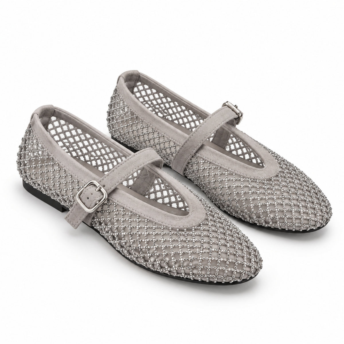 A pair of women's Mary Jane flats in a textured silver-gray mesh and suede material, featuring a single strap with a silver buckle, shown on a white background.