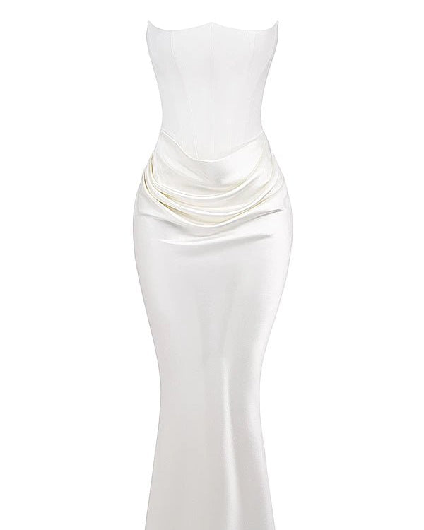 White strapless dress with a draped design on a white background