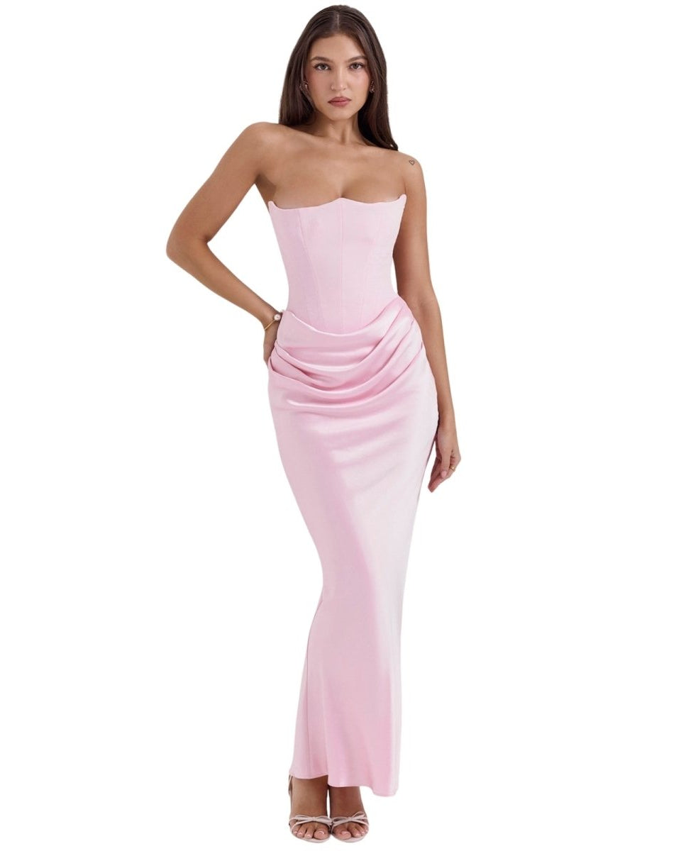 Woman wearing a strapless pink dress on a white background