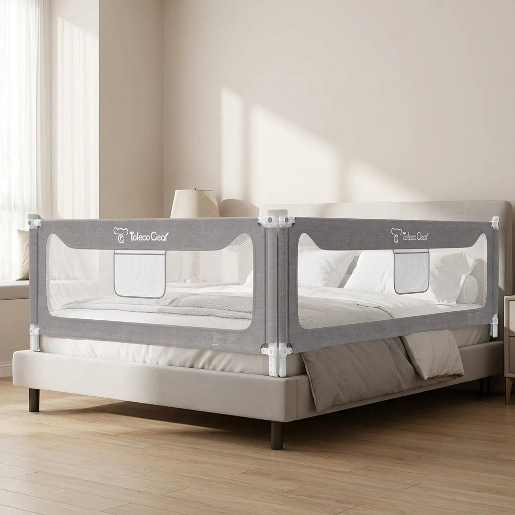Kouvr SlumberHaven Guardian extra tall toddler bed rail guard arranged in an L-shape configuration on a contemporary platform bed with neat neutral linens.