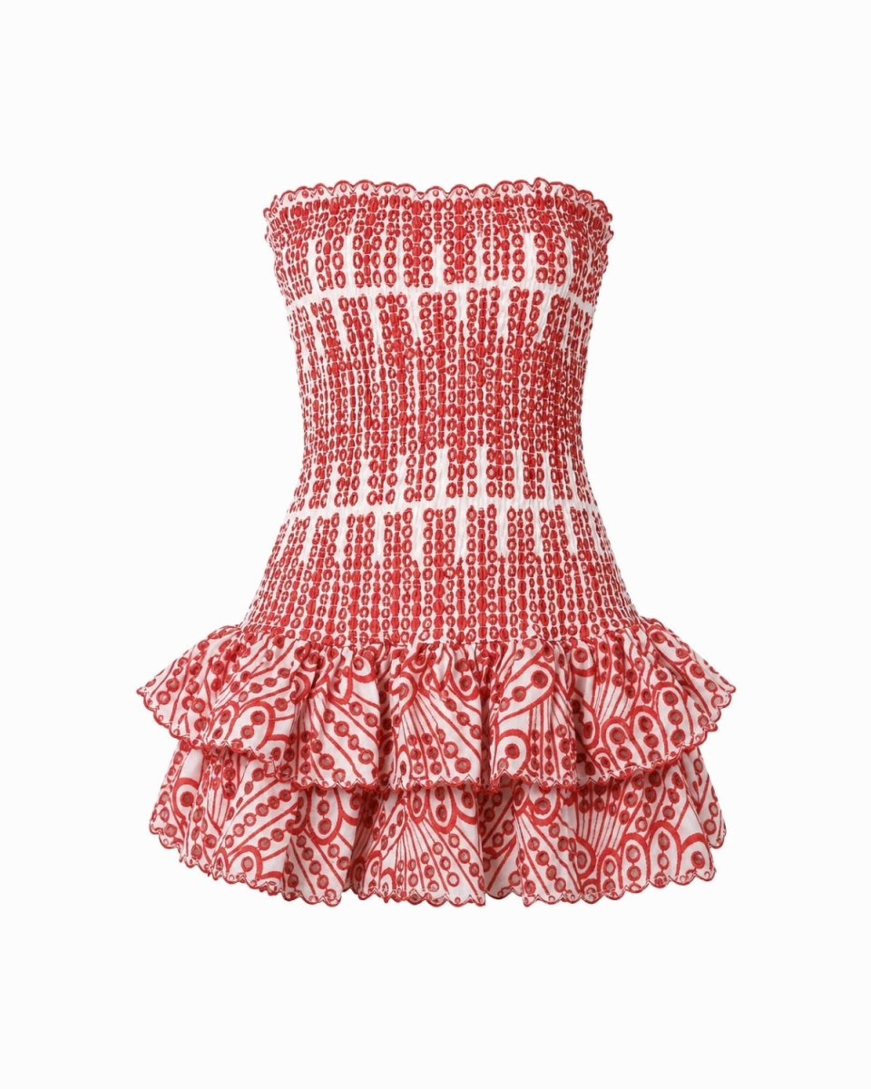 A strapless smocked ruffle mini dress featuring a red and white patterned design, shown against a plain white background.