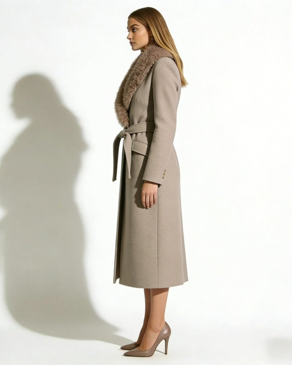 Side profile of a woman in the Trisha belted long wool coat, showcasing its elegant silhouette and length.