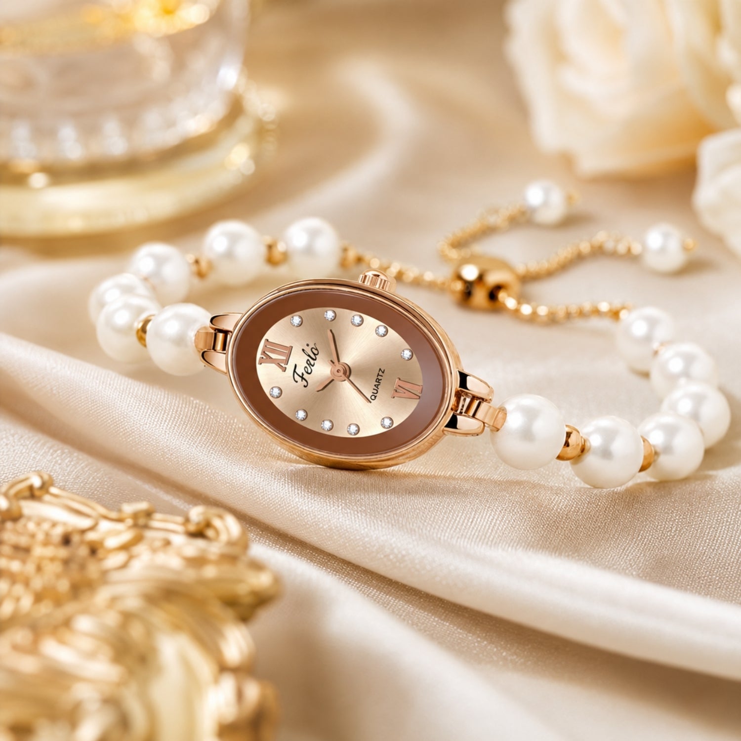Close up flat lay of a vintage style women's oval wristwatch showing the adjustable rose gold chain slider clasp and lustrous pearl band.