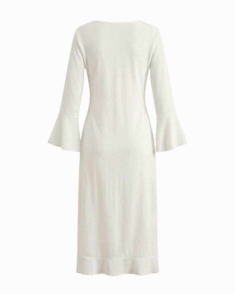 Flatlay of the back of the white long sleeve maxi cover up with bell sleeves against a white background.