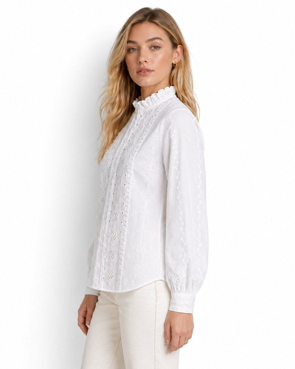 Side profile of woman modeling the white embroidered cotton victorian top
