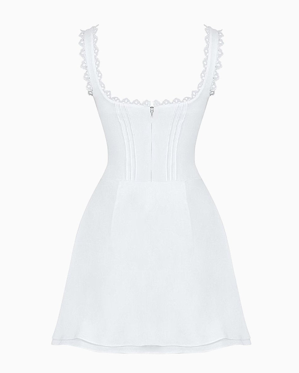 Product-only image of the back of the white lace trim mini dress, showing the clean lines and zipper placement.