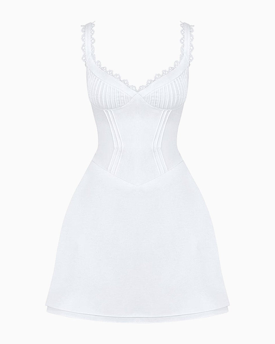 Flatlay studio shot of the white corset mini dress with lace trim, highlighting the structured boning and bust detailing.
