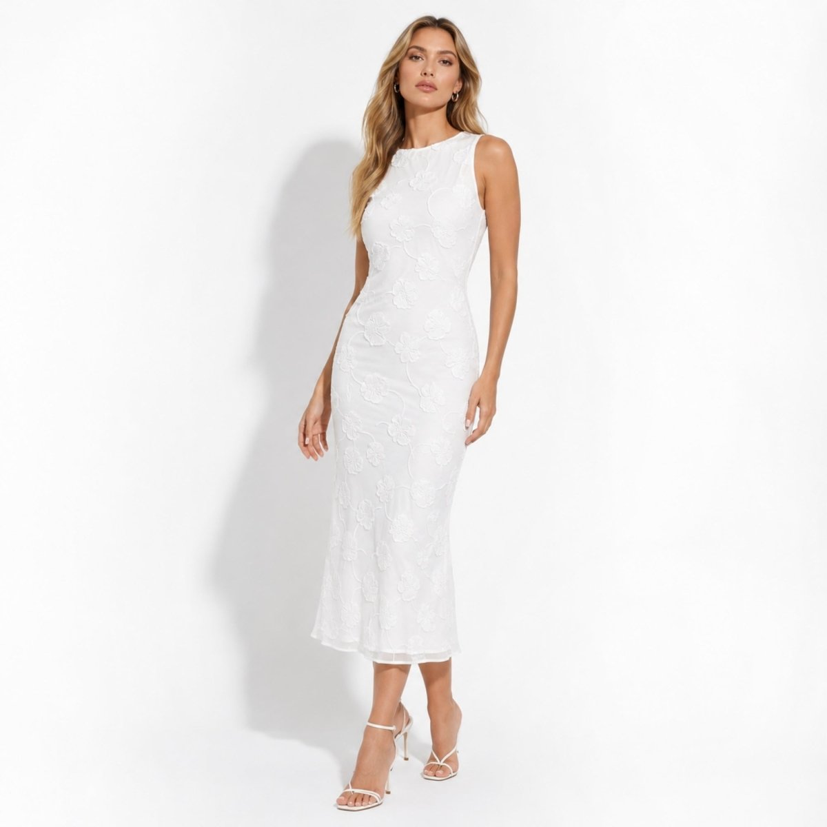 Elegant white floral burnout sleeveless maxi dress on model facing forward