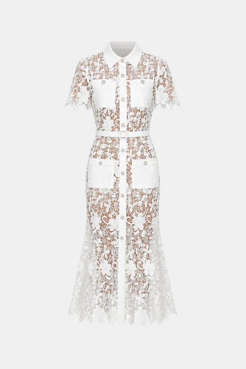 Flat lay front view of a white lace button up dress featuring four pockets, sharp collar, and adjustable waist belt.