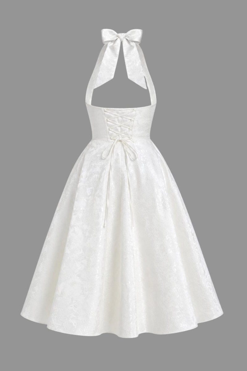Ghost mannequin back view of the Kouvr white lace-up corset midi dress showing the functional ties and open back design.