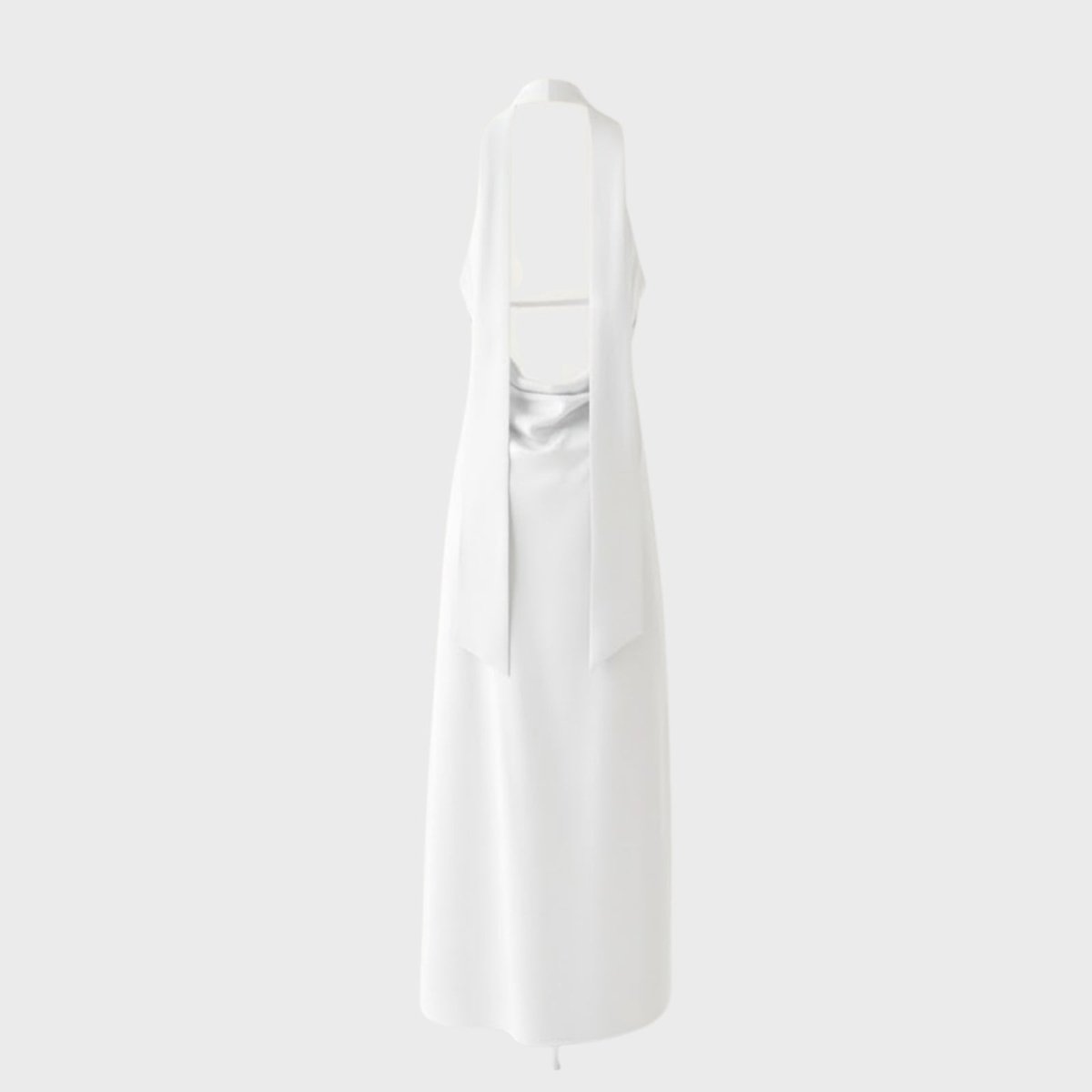 Product-only image of the white Sharon halter gown from the back, displaying the open back and tie details.