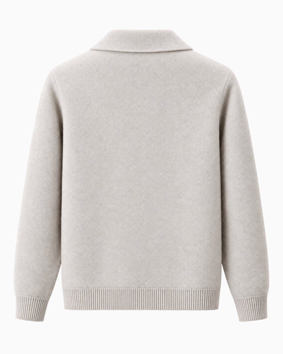 A white knit sweater shown from the back, featuring a mock neck collar and ribbed cuffs and hem, on a plain white background.