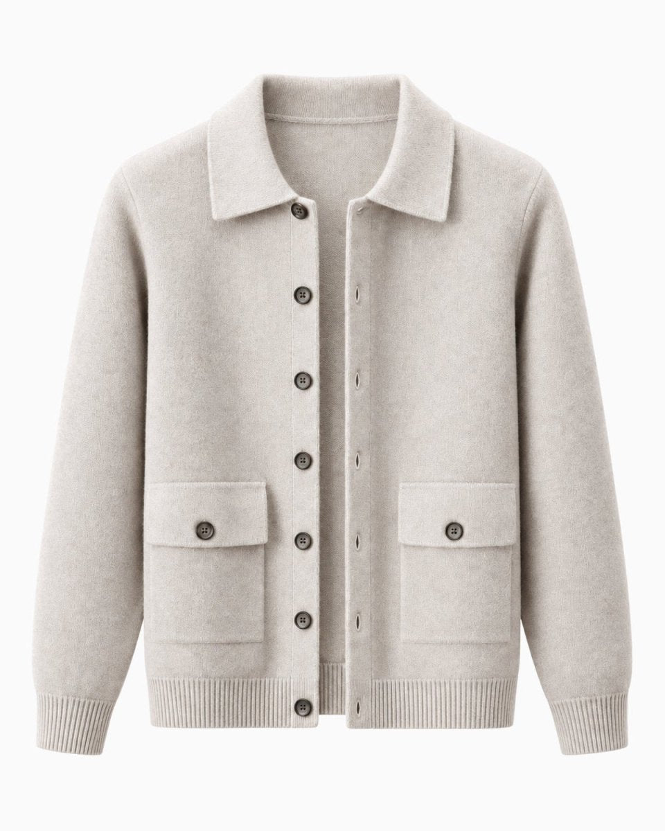 A whiteknit cardigan sweater with a collar, dark buttons, and two front flap pockets, shown on a plain white background.
