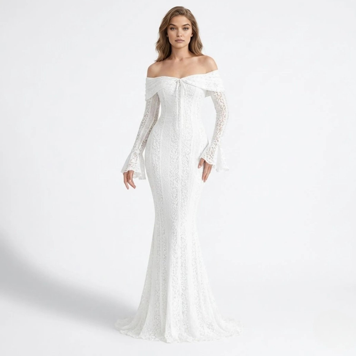 Woman wearing Kouvr white lace off the shoulder maxi dress with long bell sleeves standing facing forward against a white studio background