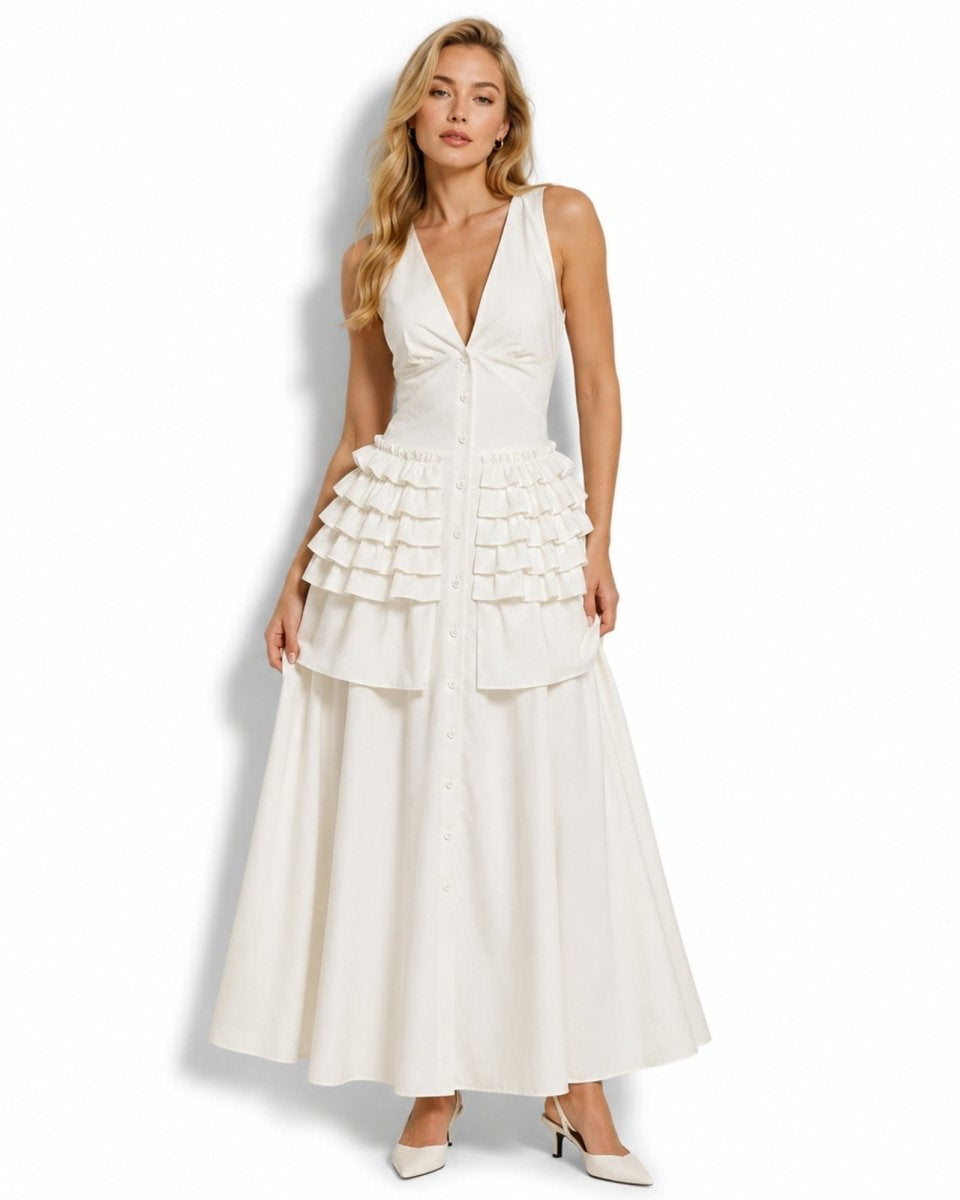 Studio shot of white button-down tiered ruffle vacation dress showcasing the flattering v-neckline and full skirt.
