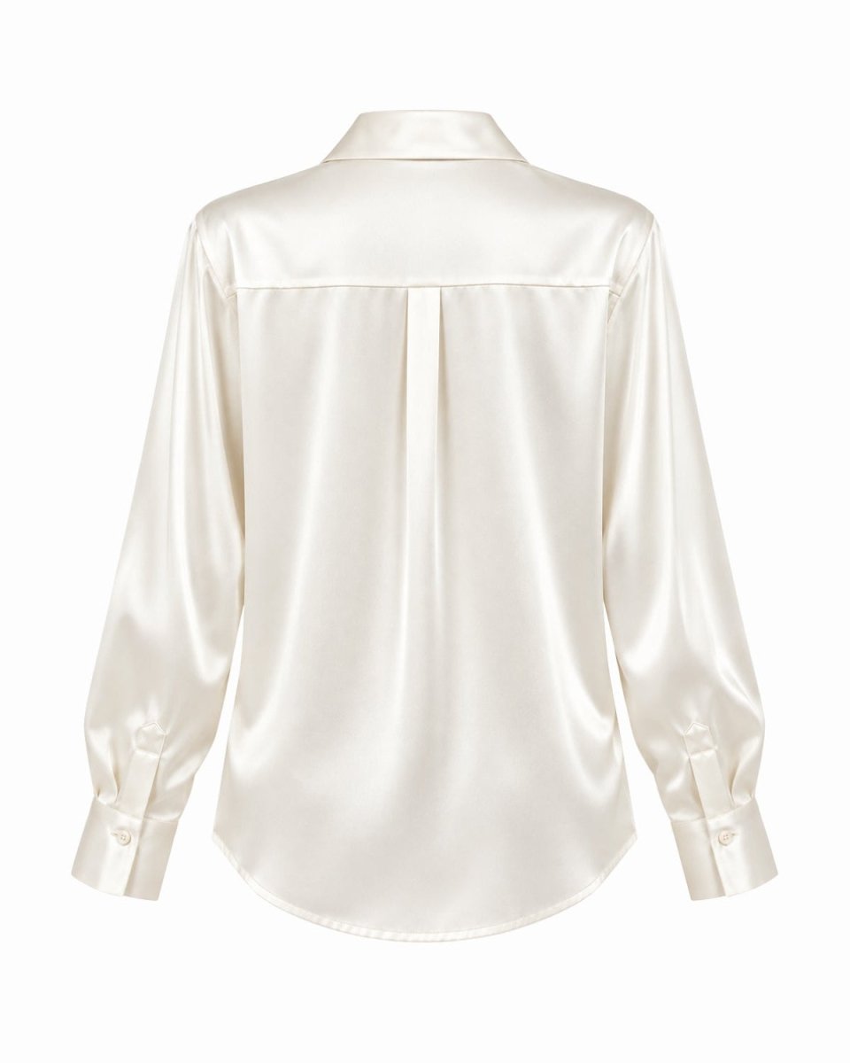 An white silk long-sleeve blouse shown from the back, featuring a subtle center back pleat and buttoned cuffs, set against a plain white background.