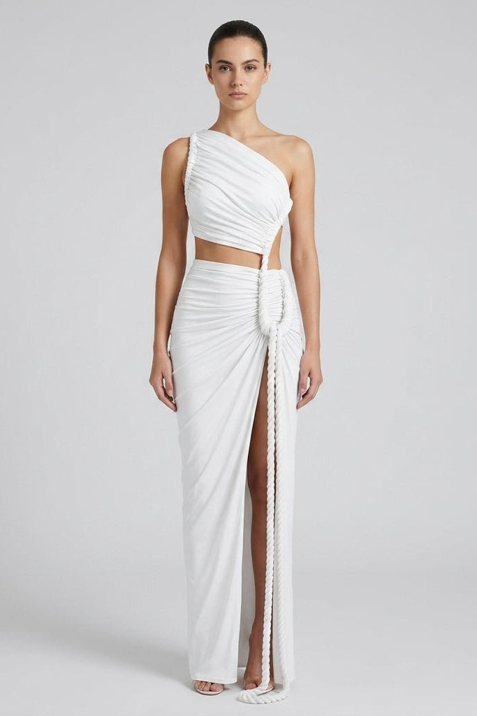 Front view of the Fenlo Form white one shoulder cutout ruched maxi dress featuring a distinctive thick rope tie and high leg slit on a female model.