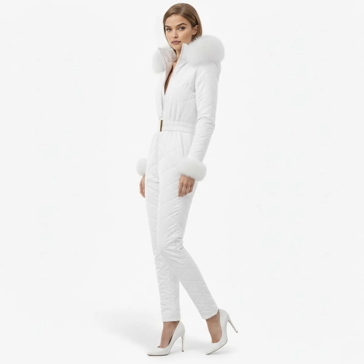 Woman in a side profile pose wearing a white belted ski jumpsuit with a diamond-quilted pattern and plush faux fur trim on the hood.