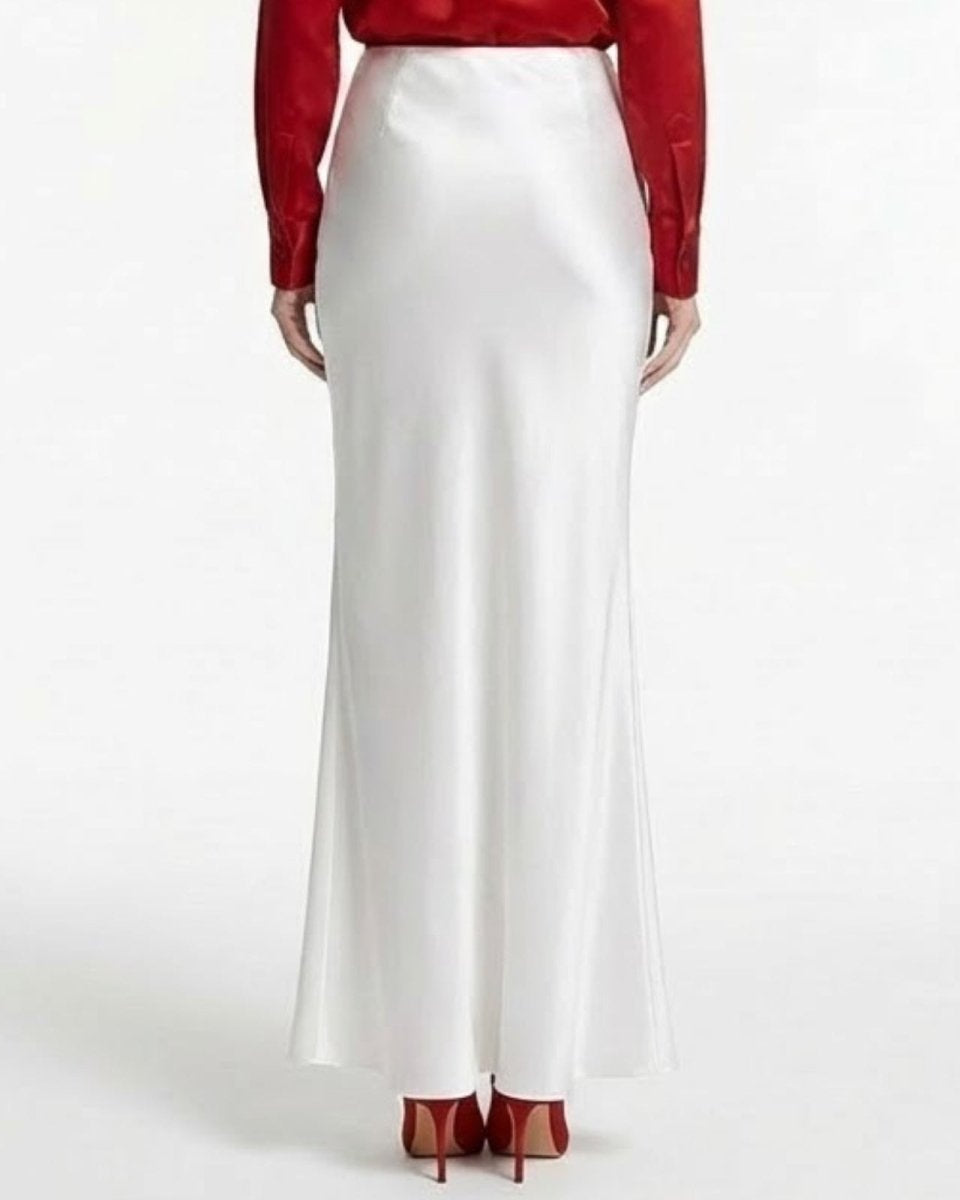 Studio product shot of the ivory white silk bias cut maxi skirt on a white background.