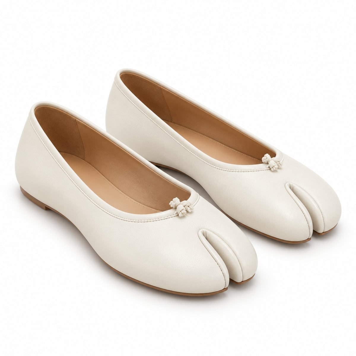 A pair of off-white split-toe ballet flats with small pearl-like bow details on the toes, shown on a clean white background.